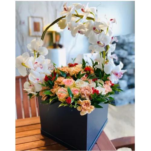 Mix arrangement of flowers in square box