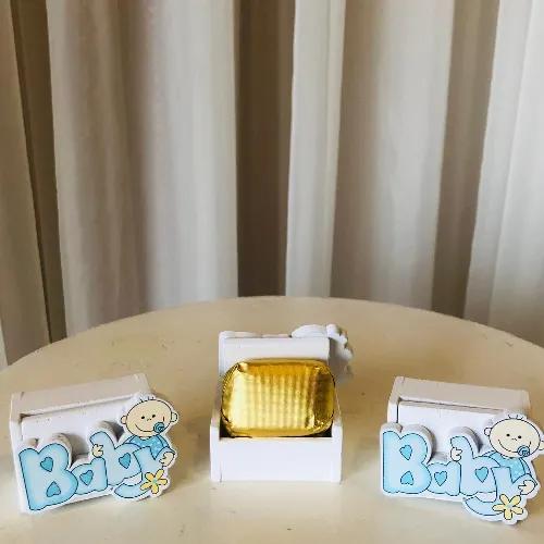 Baby boy white and blue design in a small box with one chocolate