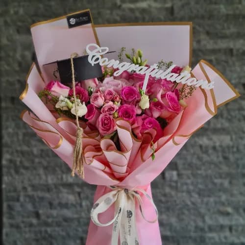 Hand Bouquet With Assorted Pink Flowers For Graduation