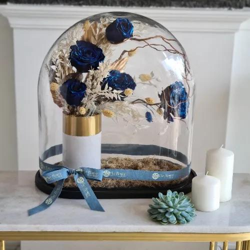 Big Dome With A Vase Of Preserved Blue Roses And Leaves