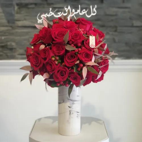 Marble Vase With Red Roses And Red Hypericum