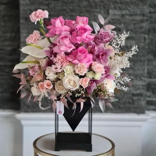 Black Floral Stand With White And Pink Flowers