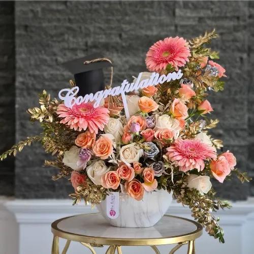 Vase With Assorted Peach Flowers