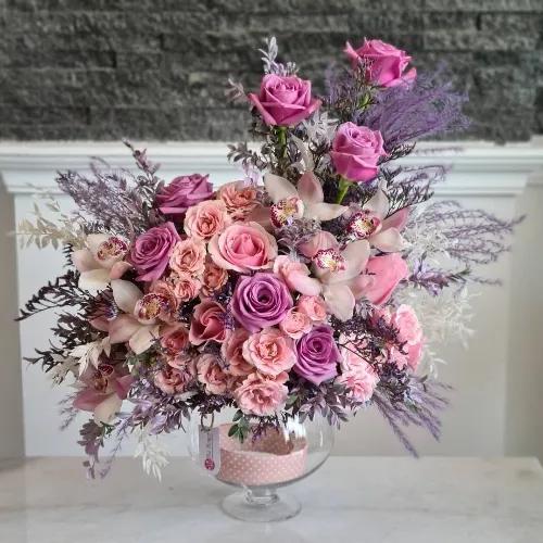 Clear Vase With Pink And Purple Flowers