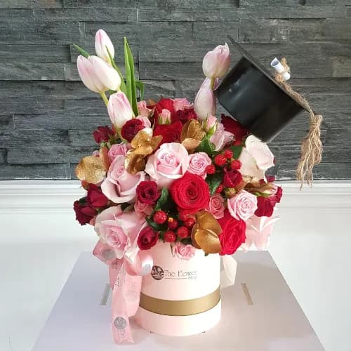 Small Pink Round Box With Mixed Flowers For Graduation