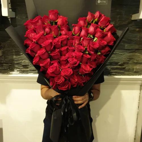 Hand Bouquet With Red Roses Heart Shape In Black Paper Wrapping