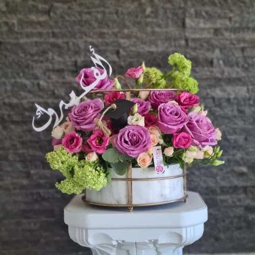 Marble Stand With Purple Flowers For Graduation