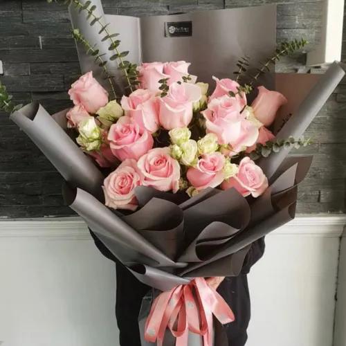 Hand Bouquet With Pink Roses And White Baby Roses