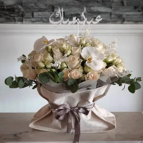 Floral Bag With White Flowers And Green Leaves