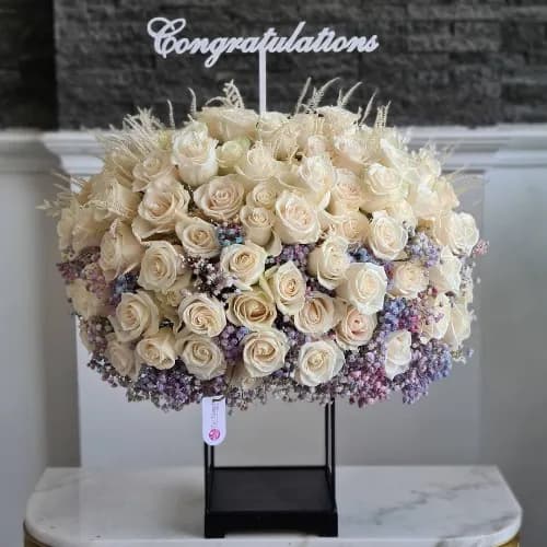 Black Floral Stand With White Roses And Purple Gypsophila