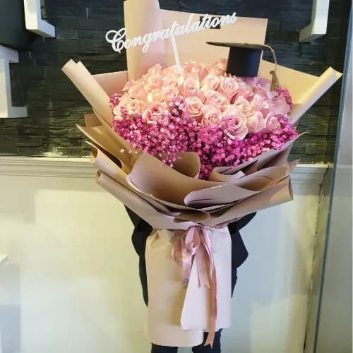 Hand Bouquet With Pink Roses And Fuisha Gypsophila For Graduation