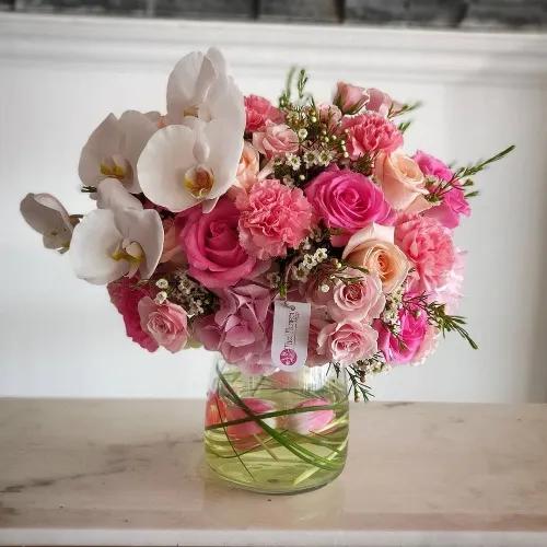 Clear Glass Vase With Assorted Pink Flowers