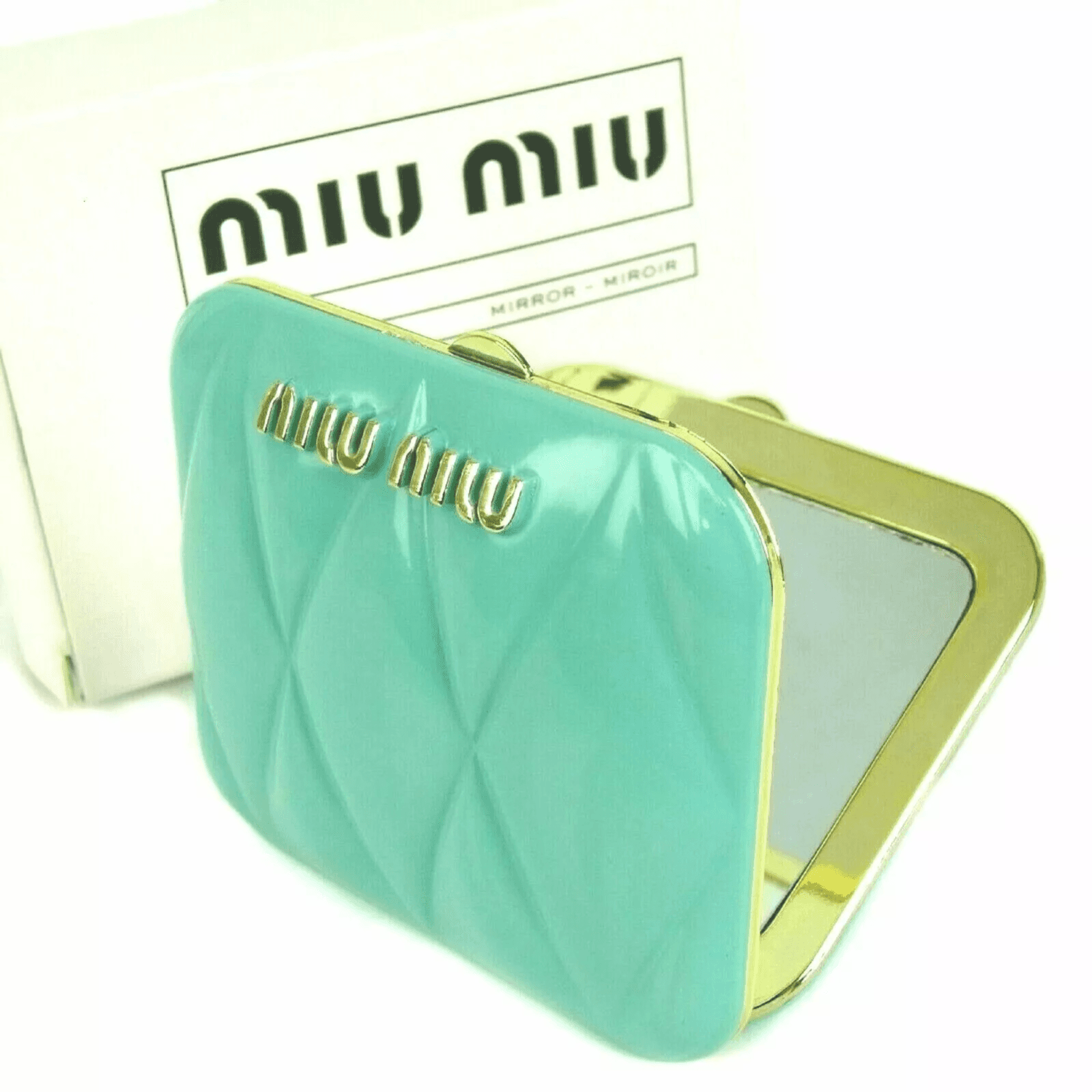 مرآة مبطنة زرقاء نادرة من Miu Miu