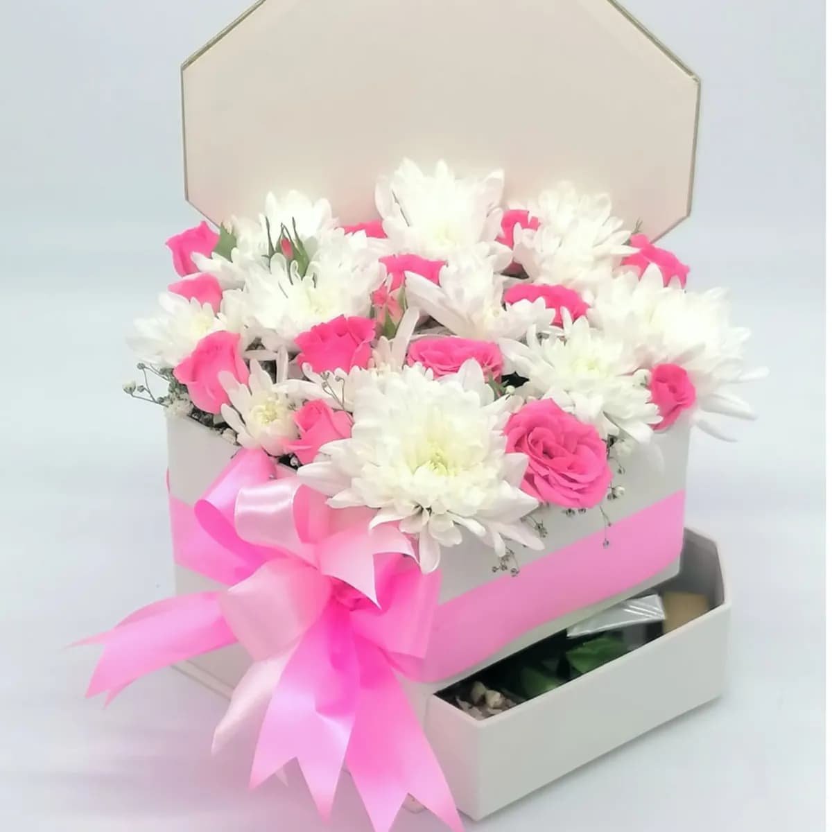 White Heart Shape Box Consisting Of A Natural Mix Of Roses And A Mix Of Chocolate