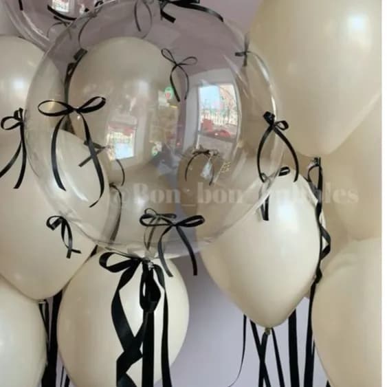 Group Of White Sand Balloons And Transparent Balloon With Coquette Design