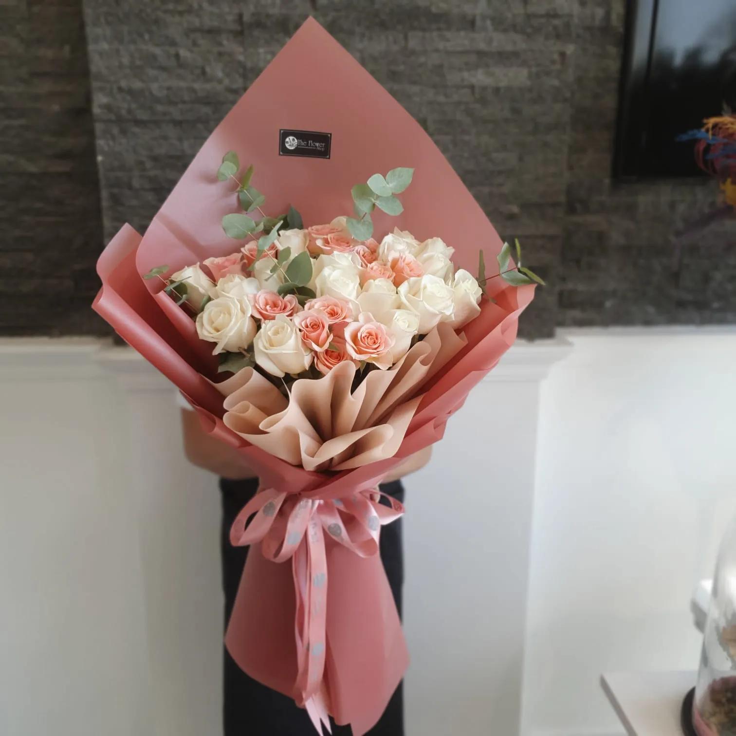 Hand Bouquet With Peach Baby Roses And White Roses