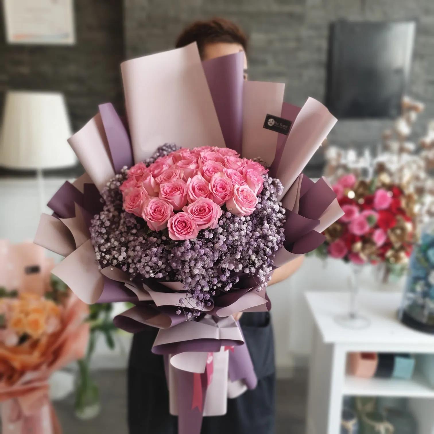 Hand Bouquet With Dark Pink Roses And Purple Gypsophila