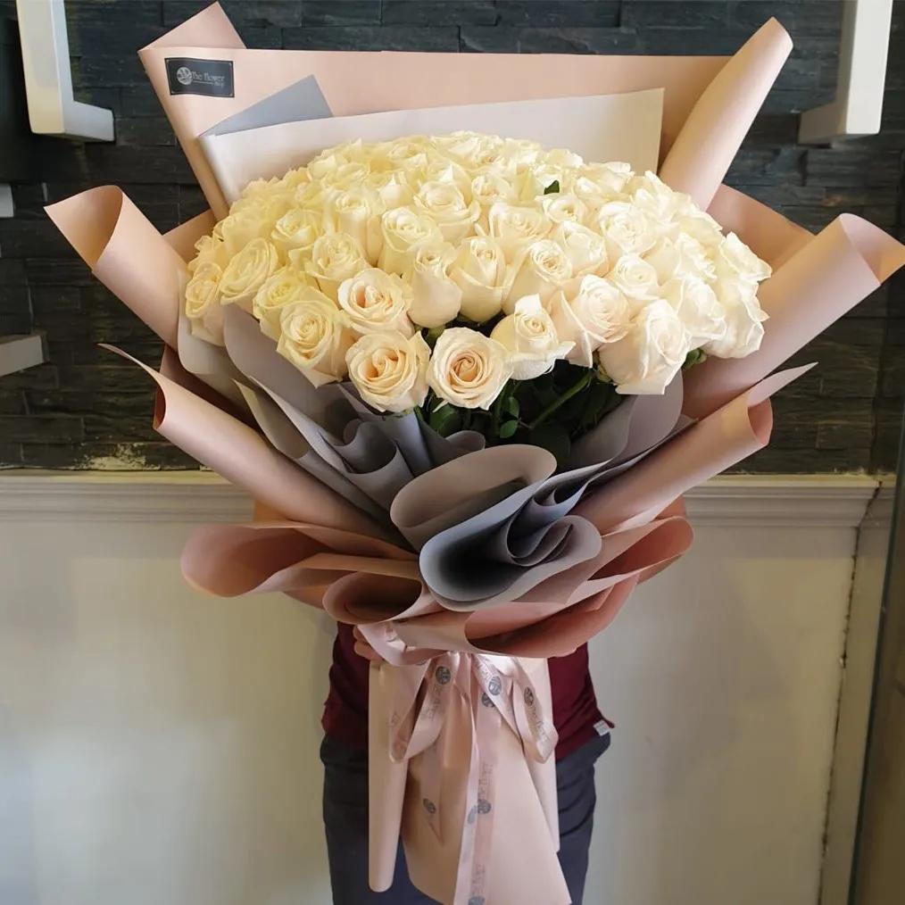 Hand Bouquet With White Roses