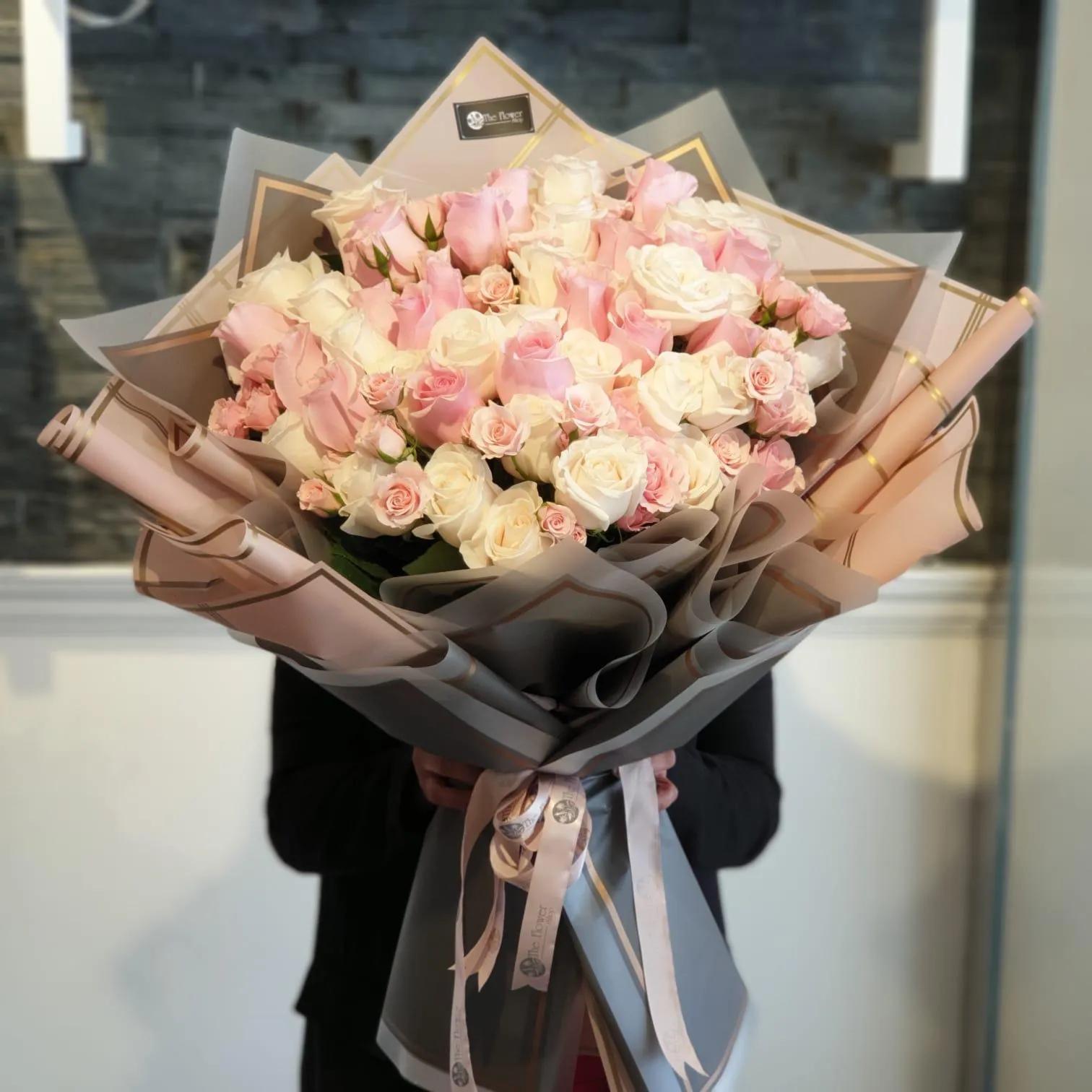 Hand Bouquet With Pink And White Roses