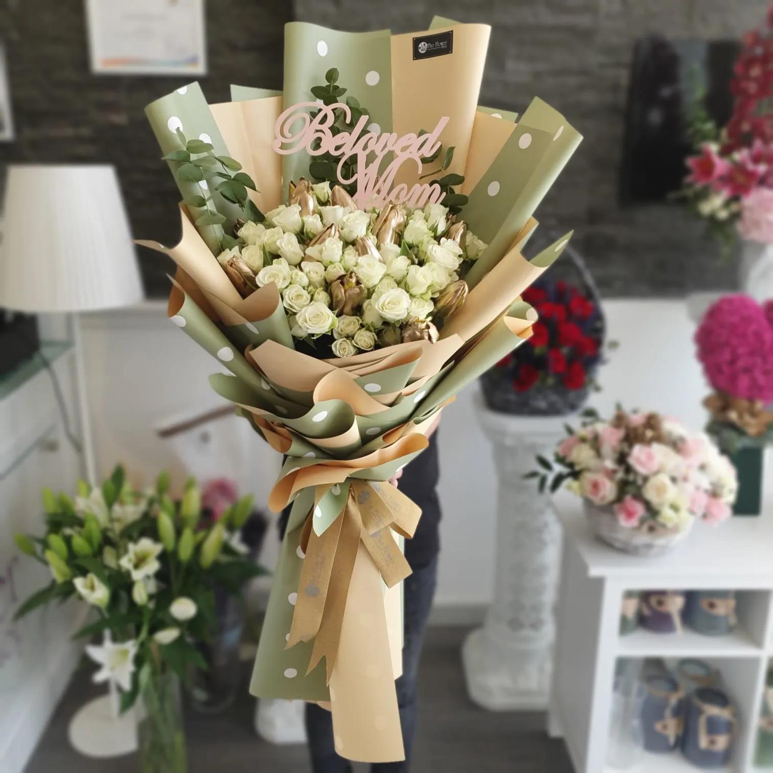 Hand Bouquet With White Baby Roses And Gold Tulips