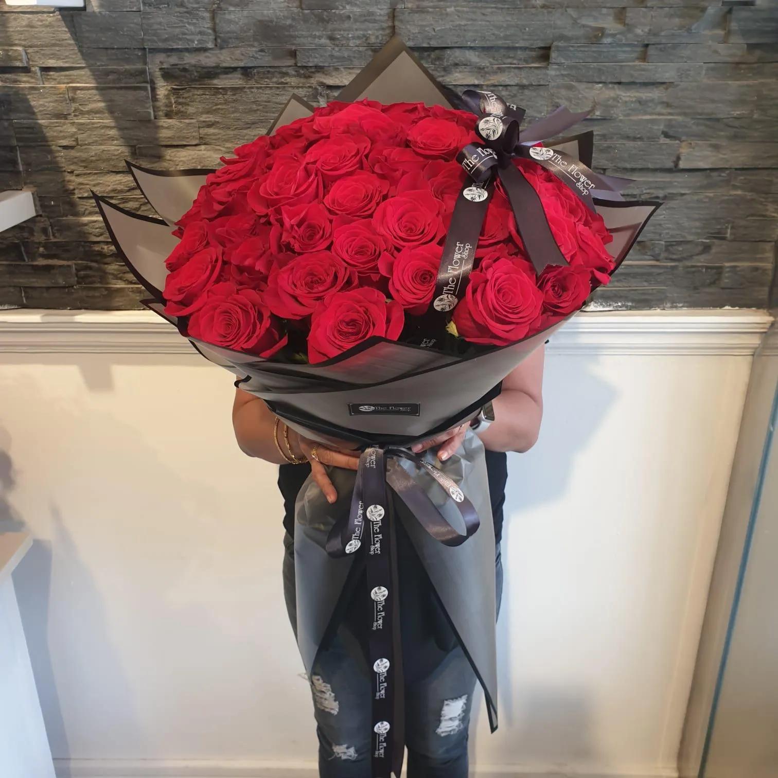 Hand Bouquet With Red Roses