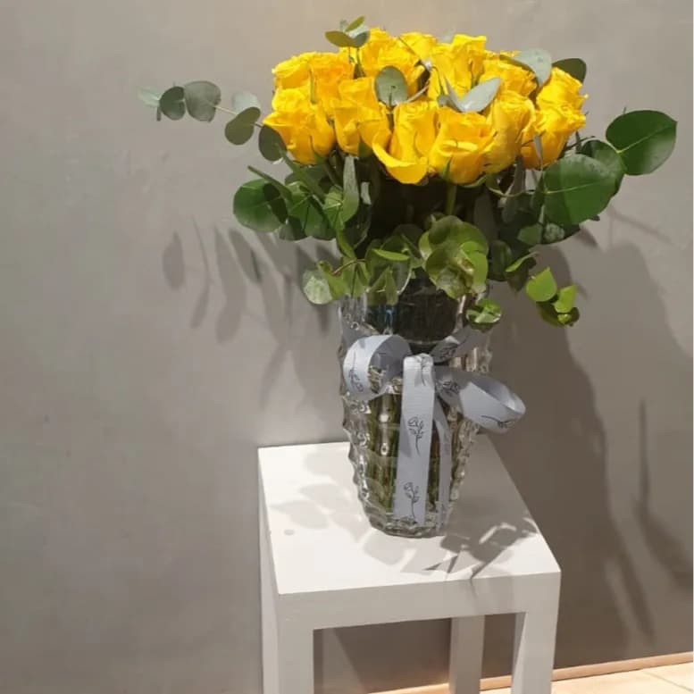 Glass Vase With Flowers Arrangement