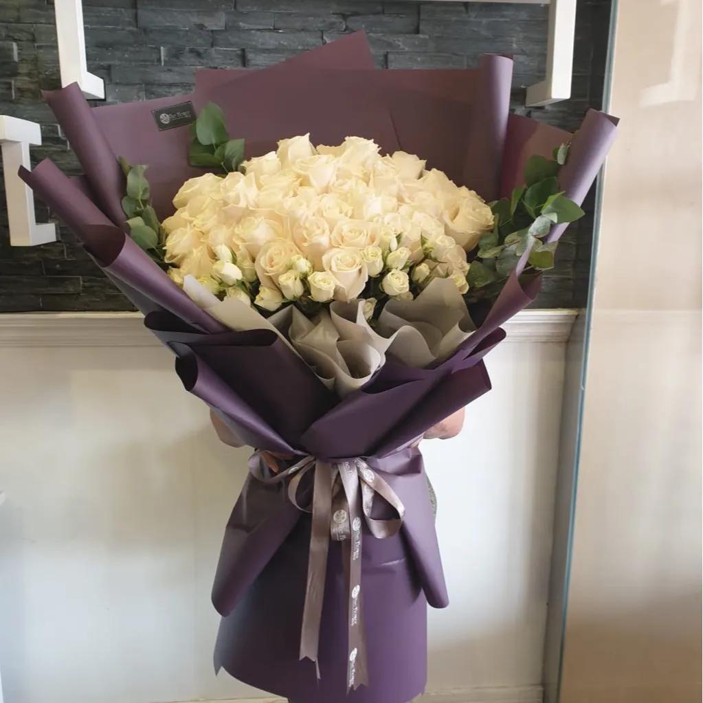 Hand Bouquet With White Roses And White Baby Roses