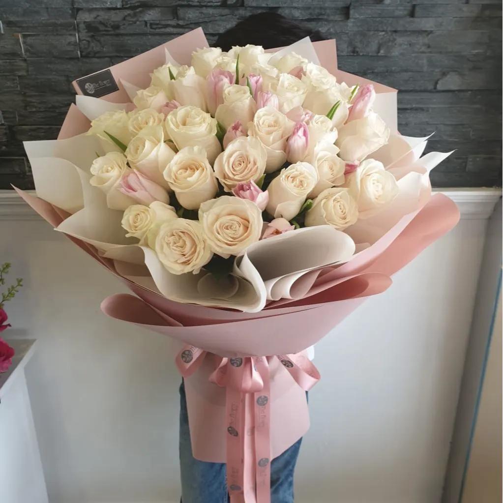 Hand Bouquet With White Roses And Pink Tulips